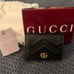 Gucci Black Chevron Wallet with Gold Emblem